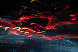 Colorful light trails on a dark background